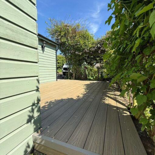 Champagne Light Oak Composite Decking With Stone Grey L Profile From Tough Decking - Fixed To Joist With The X Clips